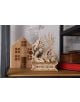 The 3D дървен пъзел Ugears - Дракон, 141 части е детайлна драконова фигурка, държаща червен орб на декоративна основа, разположена пред дървена къщичка с прозорци и книги на рафт.-7-thumb