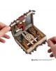 Човек отваря 3D дървен пъзел Ugears - Хари Потър Книгата на чудовищата (195 части), разкривайки зъбни колела и вдъхновени от фантазията детайли от Книгата на чудовищата, с логото на Хари Потър в ъгъла.-6-thumb