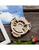 3D дървен пъзел Ugears - Календар, 24 части се намира върху дървена повърхност в селски стил, до червена роза, бяла рамка за снимка и картичка с птици, кацнали на тел под синьо небе с облаци.-6-thumb