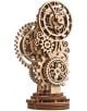 3D дървен пъзел Ugears - Steampunk Clock 2.0 (40 части) е механичен модел с преплетени зъбни колела и фини лазерно изрязани детайли, изправен върху кръгла основа.-1-thumb