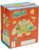 Кутията "Пъзел Floss & Rock, Dino - Динозаври, 60 части" включва пъзел с форма на карта на динозавър с илюстрации на животни и забележителности, парче за проба, етикет "Пъзел с форма" и дръжка на райета отгоре.-2-thumb
