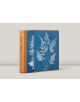 Анна Аткинс, Цианотипи: Голяма синя книга с подходящ калъф с изображение на бяла папрат в цианотипия. Книгата представя ботаническа фотография, има оранжево гръбче и ръбове, разположени на обикновен светлосив фон.-2-thumb