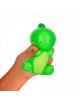 Една ръка стиска Антистрес фигурка Legami - Dino, зелена играчка динозавър със симпатичен заоблен дизайн, малки ръчички и крачета и оребрено коремче на бял фон.-2-thumb