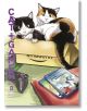 Две котки, една черно-бяла и една карикатурна, седят в кутия на Amazon с контролер за игра и два калъфа наблизо - сцена точно от Cat + Gamer, Vol. 8, идеална за всеки фен на мангата за видеоигри и очарователните котки.-thumb