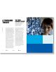 Разпространение в списание от "Цветовете на филма: с близък план на жена с къса тъмна коса, която гледа към сини стъклени орнаменти над сини цветни блокове.-2-thumb