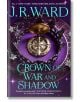 Корица на книгата Crown of War and Shadow (Kingdoms of the Compass, Book 1) от Джей Ар Уорд, на която е изобразена златна корона с лилави скъпоценни камъни, бели цветя и светещ фон с лилави и тилови акценти. Името на автора в голям златен текст в горната -thumb