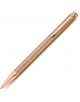 Химикалка Caran d'Ache Ecridor Chevron Rose Gold в цвят розово злато с текстуриран корпус, разположен под ъгъл върху бял фон. Химикалката е снабдена с клипс и механизъм за завъртане в горната част, предлага се в Книжарница Orange.-1-thumb