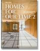 Корицата на Homes For Our Time: Contemporary Houses Around the World, Vol. 2 показва модерен дървен интериор със стилни акценти на каменния под и слънчева светлина, която прониква през обширни стъклени прозорци.-1-thumb
