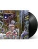Обложката на албума Iron Maiden - Somewhere in Time (VINYL) изобразява футуристична фигура на киборг в неоново осветен град с небостъргачи и табели, а вдясно се вижда частично голяма черна винилова плоча.-thumb