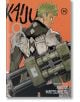 На корицата на Kaiju No. 8, Vol. 14 зеленокос член на Японските отбранителни сили в броня държи голямо оръжие и стои на оранжев фон, гледайки решително през рамо.-1-thumb