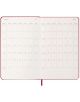 Класически червен ежедневник тефтер-органайзер Moleskine Scarlet Red 2026 г. С твърди корици е отворен на месечните календари за март и април 2026 г. с отбелязани дни, седмици и червена лента за отбелязване по средата долу.-4-thumb