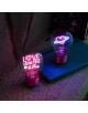 Лампата Legami Bulb Fiction - Love is in the air, с неоново сърце и светещо послание "LOVE IS IN THE AIR", е поставена върху синя тетрадка, което я превръща в цветен, декоративен подарък за Свети Валентин.-6-thumb