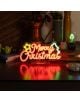 Лампа Legami It's A Sign - Merry Xmas е LED табела с неонов ефект, която свети в червено и жълто с надпис "Merry Christmas" и зелена рамка коледна елха със звезда. Подходяща за празнична украса.-5-thumb