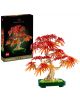 Комплектът „LEGO Botanicals Малък слънчев букет“ е изложен в сглобено състояние като декоративен модел пред кутията си, на която е изобразен готовият букет от цветя на тъмен фон.-2-thumb