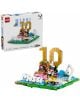 LEGO Editions „Лионел Меси“ е идеален за феновете – комплектът включва фланелка с номер 10, гол, трофей и минифигурка. Кутията с 500 части и логото на Messi се вижда на заден план.-2-thumb