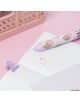The многоцветна химикалка Grupo Erik Pusheen Moments с 10 цвята и сладък дизайн лежи върху тефтер с точки, до лилава щипка, прасковена кошничка и цветна хартия - идеален подарък за фенове на Pusheen.-6-thumb