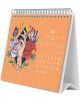 Настолен календар Grupo Erik - Frida Kahlo 2026 показва април с бели дати на оранжев фон и илюстрация в стил Фрида Кало: ръка с клонче, заобиколена от червени и лилави цветя и две пеперуди.-2-thumb