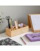 Подредено бюро с бамбуков органайзер за канцеларски материали, лилав плетен калъф с химикалки и очила и Настолен седмичен планер Miquelrius Golden Jazmine А4 на бялата повърхност.-4-thumb