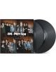 На обложката на албума One Direction - Four (2 VINYL) петимата членове на групата позират заедно на дървена стена, а до обложката се виждат частично две винилови плочи.-thumb