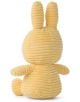The Плюшена играчка Miffy Eco Corduroy - кремаво-жълт заек, 23 см е изработена от рипсено кадифе, с дълги изправени уши и кръгла опашка, показана отзад с едната лапа настрани.-3-thumb