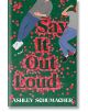 Корицата на книгата Say It Out Loud представя двама души, лежащи на зелена трева, заобиколени от червени цветя, които образуват заглавието. Виждат се само части от телата им, което загатва за вълшебна романтична атмосфера.-thumb