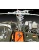 Близък план на сглобяем модел Revell - Хеликоптер Alouette II (мащаб 1:32), показващ сглобката на ротора, детайлни механични части, пожарогасител, контролни панели, германско знаме и оранжев авариен панел с черен кръст.-4-thumb
