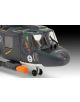 Близък план на Сглобяем модел Revell - Хеликоптер Westland Lynx MK.88A пилотска кабина и нос с прозрачни прозорци, фигури на пилоти, детайлни десетолъчки, ракета под страната и тъмносив военноморски хеликоптер с различни маркировки.-4-thumb
