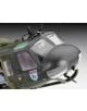 Близък план на сглобяем модел Revell - военен хеликоптер Bell UH-1D SAR с тъмно затъмнени прозорци, черен нос, емблема LTG 63 със синя птица и реалистичен камуфлажен екстериор в мащаб 1:72.-3-thumb