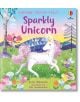 Корица на Sparkly Touchy-Feely: Еднорог, с бял еднорог с искряща грива в жив, причудлив пейзаж с дървета, цветя и приятелски настроени животни.-thumb