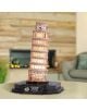 Светещият 3D пъзел Cubic Fun - Наклонената кула в Пиза, 42 части, е умален модел с осветление, разположен на маса в помещение с неясен фон от камина и декоративни светлини.-5-thumb