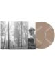 Комплектът Taylor Swift - Folklore (2 VINYL) включва два диска с тен и обложка на албума в сива гама, изобразяваща високи, мъгливи дървета с човек сред тях, както и изображение на Тейлър Суифт в профил, облечена в пуловер.-thumb