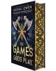 Корица на книгата "Игрите на боговете" с две богато украсени кръстосани брадви, сини и златни символи, вдъхновени от Олимп, и декоративни златни мотиви по гръбнака и ръба.-1-thumb