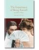 Корицата на книгата "The Importance of Being Earnest and Other Plays", на която са изобразени мъж и жена в старинна рокля, отчасти зад бяло дантелено ветрило, със златен текст върху бледосиньо - класическо подаръчно издание на Macmillan Collector's Librar-thumb