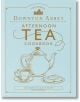 Официалната готварска книга за следобеден чай Downton Abbey е със светлосиня корица със златни илюстрации на чайник, чаша и бисквити. Идеална за феновете, които търсят елегантни рецепти за чай. Предговор от Гарет Нийм.-1-thumb