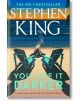 Обложката на You Like It Darker показва два празни стола край лагерния огън на плаж по залез слънце, обрамчени от палми. В долната част на корицата има цитат от рецензия, който възхвалява този смразяващ сборник с разкази.-thumb