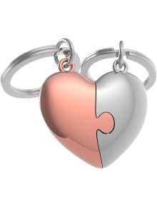 Два ключодържателя Metalmorphose - Couple Heart се съединяват в сърце - едната половина е в розово злато, другата в сребристо, с пъзел ръбове. Идеален подарък за двойки!.