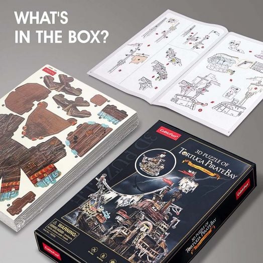 3D пъзел Cubic Fun - Пиратски кораб Тортуга, 218 части: комплектът включва листове с елементи, илюстрирана книжка с инструкции и кутия с изображение на завършения пиратски кораб. Надпис: Какво има в кутията?.-7