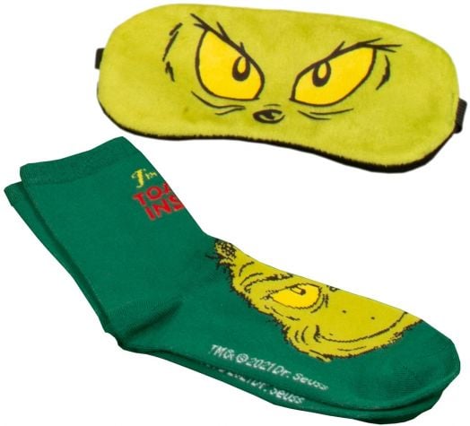 Коледният комплект "Чорапи и маска за сън Fizz Creations - The Grinch" включва зелена маска с жълти очи на Гринч и меки чорапи със зеленото му лице и жълт надпис, вдъхновени от героя на д-р Сюс.-2