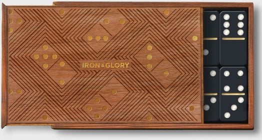 Дървена кутия с геометричен мотив и надпис Iron & Glory, частично отворена, разкриваща комплект черни домино плочки с бели точки - Игра Iron & Glory - Домино за любителите на настолни игри.-3