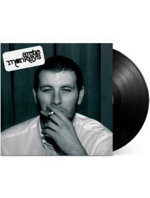 The Arctic Monkeys - Whatever People Say I Am, That's What I'm Not (VINYL) обложката на албума включва черно-бяло изображение на мъж с риза с яка, който пуши, и частично видима винилова плоча.