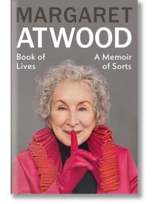 Корицата на книгата Book of Lives: Маргарет Атууд е усмихната, в червен костюм с плисирана яка, и държи пръст в ръкавица до устните си в жест на примирение.