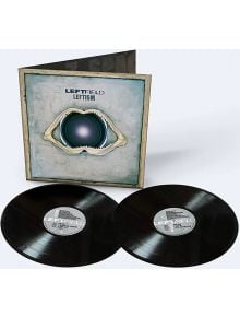 Две черни винилови плочи с надпис "Leftfield - Leftism (2 VINYL)" лежат пред емблематичната електронна музикална албумна обложка, на която е изобразен говорител с челюстна кост в синьо-сиво. В горната част са отпечатани заглавието 2023 преиздание и изпълн