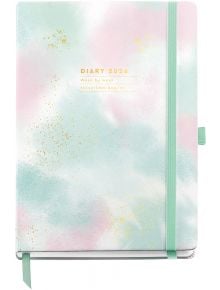 Седмичен тефтер-органайзер Miquelrius Grafica Gradient 2026 с пастелна корица със златни точици, включваща розови, сини и бели нюанси, ластик и държач за химикал. Идеален за годишно планиране; надпис: "Дневник 2026 г. Седмица по седмица".