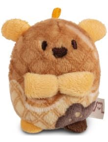 Малка, кръгла играчка от колекцията Nici Mymochi Minis, тази кафява и жълта плюшена играчка прилича на мече с бродирани очи, зашит нос, сгънати ръце, вафлена шарка, малки ушички и страничен етикет от плат.