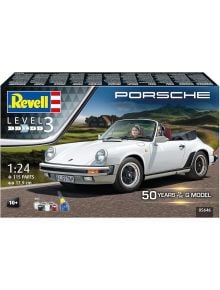 Сглобяем модел Revell - Porsche 911 G-Model Cabrio: бяла класика G-Series 911, управлявана от жена по живописен път. Кутията показва LEVEL 3, мащаб 1:24, "50 YEARS OF THE G MODEL", и икони за боя, четка и лепило.