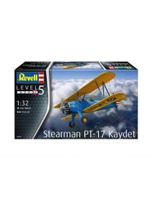 Кутията на сглобяем модел Revell - самолет Стеарман PT-17 Кайдет (мащаб 1:32, 102 части) показва илюстрация на жълто-синия биплан, летящ над облаците.