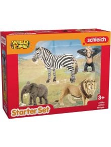 Schleich стартов комплект Wild Life с играчки зебра, шимпанзе, слон и лъв от Африка, подходящ за деца над 3 г. Кутията е в червено и жълто със снимки на африкански животни. Предлага се в книжарница Orange.