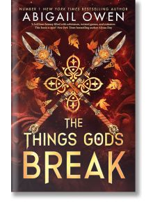 Корицата на книгата "Нещата, които боговете чупят" показва два богато украсени меча, кръстосани върху златен модел, вихрещи се есенни листа и тъмен, огнен фон - напомнящ за царството на Хадес и тайните на царя на подземния свят.